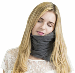 Woman wearing a Trtl Travel Pillow